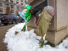 Flowers at the scene of a shooting from the previous night that left six dead, including the shooter at a condo building on Jane St, just north of Rutherford Rd. in Vaughan, On. on Monday December 19, 2022.