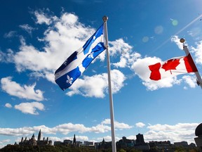 Canadian Flag and Quebec Flag are seen over looking the Ottawa River from the Civilization Museum behind Parliament Hill in Gatineau Sept 19, 2012.   (ANDRE FORGET/QMI AGENCY)