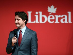 Justin Trudeau holding a microphone