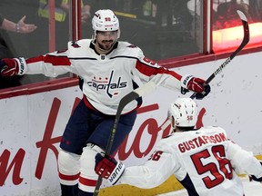 Washington Capitals left wing Marcus Johansson celebrates his game-winning overtime goal with defenceman Erik Gustafsson during overtime NHL action against the Ottawa Senators, Thursday, December 22, 2022 in Ottawa.