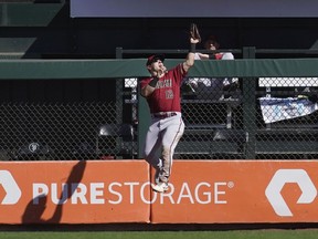 Arizona Diamondbacks center fielder Daulton Varsho (12) catches a fly out hit by San Francisco Giants' Joey Bart during the fourth inning of a baseball game in San Francisco, Sunday, Oct. 2, 2022. The former Arizona Diamondback was sent to Toronto in exchange for outfielder Lourdes Gurriel Jr. and catcher Gabriel Moreno on Friday.