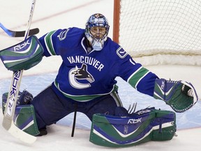 Vancouver Canucks' goaltender Roberto Luongo makes a save during the third period against the New Jersey Devils at GM Place in Vancouver Tuesday, Dec. 18, 2007. The Canucks won the game 5-0.