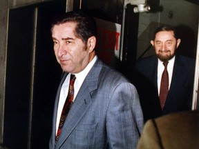 Albert Reichmann, left, and his brother Paul Reichmann leave a creditor meeting for Olympia & York in 1992. At their height of success, the Reichmann's along with brother Ralph were referred to as the "Rothschilds of Canadian realty."