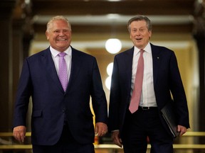 Ontario Premier Doug Ford (left) walks alongside Toronto Mayor John Tory.
