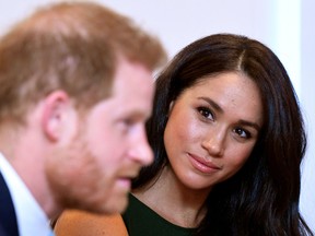 Meghan, Duchess of Sussex, with her love and living embodiment of British colonialism, Harry.