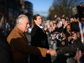 King Charles III greets members of the public as he visits Luton Town Hall.