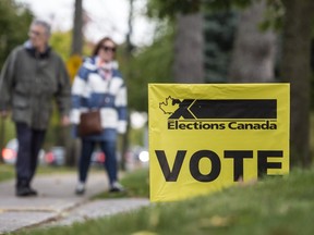 People arrive at Clarkson Presbyterian Church in Mississauga to vote in the 2019 Federal election, Monday October 21, 2019.