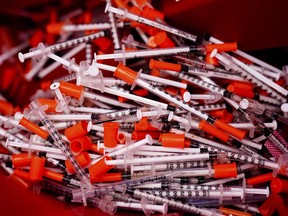 Shown are used syringes collected at a needle exchange run by Camden Area Health Education Center in Camden, N.J., Thursday, Feb. 24, 2022.&nbsp;Health advocates say the federal prison needle exchange program is failing because of a poor rollout by the Correctional Service and a lack of improvement since it was first introduced in 2018.