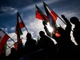 Protestors wave Iranian pre-Islamic revolution flags in Geneva.