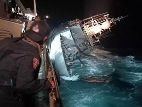 This handout taken on December 18, 2022 shows the warship HTMS Sukhothai on its side before sinking in the Gulf of Thailand. Royal Thai Navy / AFP