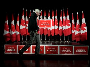 A worker checks the stage before the arrival of Liberal candidate Charles Sousa at his byelection election night headquarters for the riding of Mississauga-Lakeshore in Mississauga, Ont., Monday, December 12, 2022.