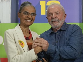 FILE - Brazil's former President Luiz Inacio Lula da Silva, who is running for reelection, right, and congressional candidate Marina Silva, campaign in Sao Paulo, Brazil, Sept. 12, 2022. Brazil's President-elect Luiz Inacio Lula da Silva named Silva as environment minister for his incoming government, indicating he will prioritize cracking down on illegal deforestation in the Amazon.