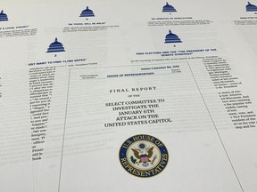 Pages from the final report released by the House select committee investigating the Jan. 6 attack on the U.S. Capitol, is photographed Thursday, Dec. 22, 2022.