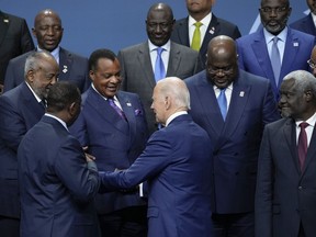 President Joe Biden speaks with African leaders as they gather to pose for a family photo during the U.S.-Africa Leaders Summit in Washington, Thursday, Dec. 15, 2022. Front row from left, Senegal's President Macky Sall, Biden and African Union Commission (AUC) chair Moussa Faki Mahamat. Second row from left, Djibouti's President Ismail Omar Guelleh, Republic of Congo's President Denis Sassou Nguesso, and President of the Democratic Republic of the Congo Félix Tshisekedi.