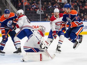 Montreal Canadiens goalie Jake Allen (34) makes the save as Edmonton Oilers' Connor McDavid (97) jumps during second period NHL action in Edmonton on Saturday, December 3, 2022.THE CANADIAN PRESS/Jason Franson