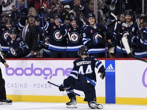 Winnipeg Jets' Josh Morrissey (44) celebrates his goal against the Colorado Avalanche with teammates during second period NHL action in Winnipeg on Tuesday, November 29, 2022.