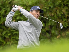 Mike Weir of Canada watches his tee shot on the 13th hole during the first round of the Canadian Open in Toronto on Thursday, June 9, 2022. The Canadian golfing great closed the Toronto Stock Exchange on Thursday evening.