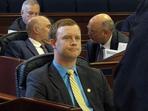 FILE - Alaska state Rep. David Eastman, R-Wasilla, sits in the House on April 29, 2022, in Juneau, Alaska. Eastman, accused of violating the state constitution's disloyalty clause over his lifetime membership in Oath Keepers, has not condemned the organization in the wake of the Jan. 6, 2021, insurrection at the U.S Capitol. "No, I generally don't condemn groups," Eastman, a Wasilla Republican, said during his bench hearing on Thursday, Dec. 15, 2022, his second day on the witness stand.