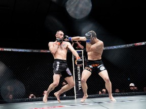 Canadian MMA fighter Shane (Shaolin) Campbell, left, is shown in action on his way to an unanimous decision win over Kyle (Killshot) Prepolec, at the Unified MMA 43 show, in Enoch, Alta., in a March 4, 2022, handout photo.