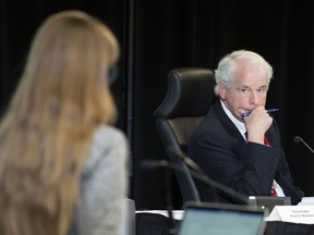 Commissioner Paul Rouleau listens to counsel question a witness at the Public Order Emergency Commission, in Ottawa, Friday, Nov. 4, 2022. Lawyers for "Freedom Convoy" organizers won their bid to gain access to unredacted versions of 20 documents at the Public Order Emergency Act.