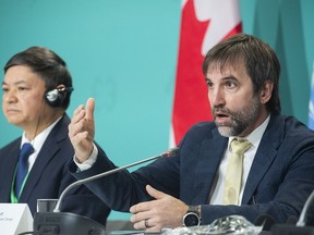Steven Guilbeault, Minister of Environment and Climate Change, Canada, right, speaks during the opening news conference of COP15, the UN Biodiversity Conference in Montreal, Tuesday, December 6, 2022, as Huang Runqiu, President, COP15 and Minister of Ecology and Environment of China looks on.