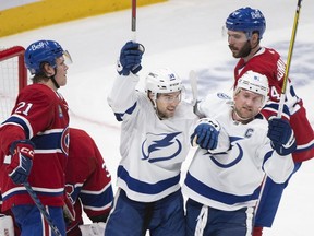 Tampa Bay Lightning's Brandon Hagel (38) celebrates a goal with teammate Steven Stamkos (91) against the Montreal Canadiens during second period NHL hockey action in Montreal, Saturday, Dec.17, 2022.