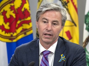 Nova Scotia Premier Tim Houston fields a question at a meeting of the Council of Atlantic Premiers in Halifax on Monday, March 21, 2022.