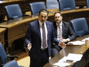 Manitoba NDP Opposition Leader Wab Kinew speaks at the Manitoba Legislature in Winnipeg on April 15, 2020. He says he'd like to bring back the annual holiday open house at the legislature if he were to be elected premier.