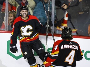 Calgary Flames forward Nazem Kadri, left, celebrates his goal with teammate Rasmus Andersson during third period NHL hockey action against the Arizona Coyotes in Calgary, Alta., Monday, Dec. 5, 2022.&nbsp;Kadri scored the game-winning goal at 15:42 of the third period and added two assists to lead the Calgary Flames to a 3-2 victory over the Arizona Coyotes on Monday.