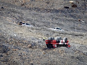 RCMP work on the scene of a sightseeing bus rollover at the Columbia Icefield near Jasper, Alta., Sunday, July 19, 2020.