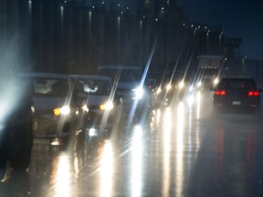 Vehicles are seen driving through the rain in North Vancouver B.C., Wednesday, Jan. 29, 2020.