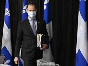 Quebec Finance Minister Eric Girard arrives to present a financial update at a news conference, Thursday, December 8, 2022 in Quebec City.