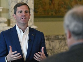 Kentucky Governor Andy Beshear answers questions during an interview with The Associated Press at the Kentucky State Capitol in Frankfort, Ky., Wednesday, Dec. 7, 2022.