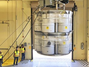 FILE - In this April 9, 2019, file photo, provided by Los Alamos National Laboratory, barrels of radioactive waste are loaded for transport to the Waste Isolation Pilot Plant, marking the first transuranic waste loading operations in five years at the Radioactive Assay Nondestructive Testing (RANT) facility in Los Alamos, N.M. On Thursday, Dec. 8, 2022, New Mexico officials outlined new conditions for a proposed permit for the U.S. government to continue disposing of nuclear waste in the southeast corner of the state as part of a multibillion-dollar federal cleanup program.