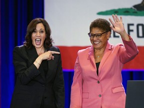 FILE - Vice President Kamala Harris, left, points to Los Angeles mayoral candidate U.S. Rep. Karen Bass, D-Calif., after speaking at a campaign rally in Los Angeles, Monday, Nov. 7, 2022. Bass, the first Black woman elected Los Angeles mayor, will be sworn-in as the 43rd Mayor of Los Angeles by Harris in an historic ceremony on Sunday, Dec. 11.