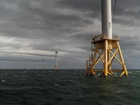 FILE - The five turbines of America's first offshore wind farm, owned by the Danish company, Orsted, stand off the coast of Block Island, R.I., in this, Oct. 17, 2022. The wind farm allowed residents of small Block Island to shut off five diesel generators. Tuesday, Dec. 6, marks the first-ever U.S. auction for leases to develop commercial-scale floating wind farms in the deep waters off the West Coast.