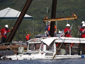 FILE - A duck boat that sank in Table Rock Lake in Branson, Mo., is raised July 23, 2018, after it went down several days earlier after a thunderstorm generated near-hurricane strength winds. A bill requiring stricter safety rules in response to the 2018 sinking of the tourist boat that killed 17 people passed the Senate on Thursday, Dec. 15, 2022, and will head to President Joe Biden.