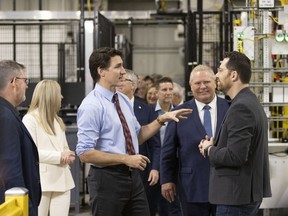 Prime Minister Justin Trudeau and Premier Doug Ford tour the General Motors CAMI assembly plant in Ingersoll, Ont., on Monday, December 5, 2022. Trudeau and Ford marked a Canadian milestone Monday, celebrating the launch of the country's first full-scale electric vehicle manufacturing plant.