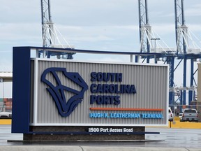 FILE - A sign marks the site of a new South Carolina Ports Authority terminal named for longtime state Sen. Hugh Leatherman on Monday, Oct. 25, 2021, in North Charleston, S.C. Work has finished on deepening the ship channel leading to the port to 52 feet so the world's largest ships can continue to dock there.