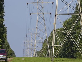 FILE - Power transmission lines deliver electricity to rural Orange County on Aug. 14, 2018, near Hillsborough, N.C. Investigators believe a shooting Saturday, Dec. 3, 2022, that damaged power substations in North Carolina was a crime. The shooting serves as a reminder for why experts have stressed the need to secure the U.S. power grid. Authorities have warned that the nation's electricity infrastructure could be vulnerable targets for domestic terrorists.