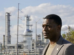 FILE - EPA Administrator Michael Regan stands near the Marathon Petroleum Refinery as he conducts a TV interview, while touring neighborhoods near the refinery, in Reserve, La., on Nov. 16, 2021. Regan is scheduled on Tuesday, Dec. 6, 2022, to visit a West Virginia county where some communities recently got access to clean water after years of having to boil it to drink because of persistent infrastructure issues.