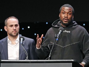 FILE - Musician Meek Mill, right, speaks about his incarceration along with Philadelphia 76ers co-owner Michael Rubin at the launch of REFORM Alliance in New York on Jan. 23, 2019. The pair shared laughs Tuesday, Dec. 13, 2022, at an outing meant to brighten the day for kids from families caught in the criminal justice system. Rubin, who recently sold his stake in the Philadelphia 76ers, co-founded the Reform Alliance, a non-profit organization dedicated to probation, parole and sentencing reform in the United States. Mill, whose well-publicized prison sentence for minor probation violations became a lightning rod for the issue, is co-chairman of the organization.