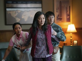 This image released by A24 Films shows, from left, Stephanie Hsu, Michelle Yeoh and Ke Huy Quan in a scene from, "Everything Everywhere All At Once."