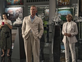 This image released by Netflix shows Jessica Henwick, left, Daniel Craig, center, and Janelle Monáe in a scene from "Glass Onion: A Knives Out Mystery."