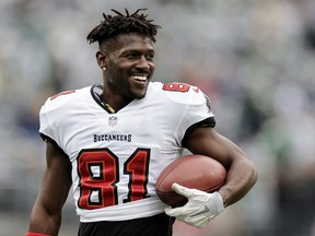 FILE - Tampa Bay Buccaneers wide receiver Antonio Brown (81) walks on the field during an NFL football game against the New York Jets, Sunday, Jan. 2, 2022, in East Rutherford, N.J. No charges will be filed against former NFL wide receiver Antonio Brown following an apparent domestic incident at a Tampa, Florida, home in late November, prosecutors said Wednesday, Dec. 21, 2022.