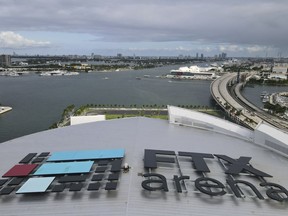 In this photo taken with a drone, the FTX logo is seen on the roof of the FTX Arena on Wednesday, Dec. 7, 2022, in Miami. The House Financial Services Committee holds a hearing on Tuesday on the collapse of cryptocurrency exchange FTX.