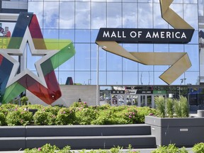 FILE - A visitor leaves the Mall of America, Thursday, June 11, 2020 in Bloomington, Minnesota. The mall reopened Wednesday after being closed since March due to the coronavirus. Police in Minnesota say the Mall of America has been placed on lockdown after a reported shooting, Friday, Dec. 23, 2022.