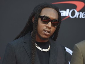 FILE - Takeoff arrives at the ESPY Awards in Los Angeles on July 10, 2019. Authorities said Wednesday, Nov. 30, 2022, that a man who has been accused of illegally having a gun at the time that rapper Takeoff was fatally shot last month outside a private party at a downtown Houston bowling alley has been charged in connection with the case.