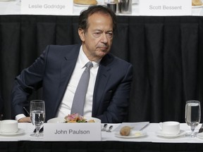 FILE - John Paulson attends a meeting of the Economic Club of New York in New York, on Nov. 12, 2019. Ten years after receiving it, New York University publicized a $100 million gift from the hedge fund leader Paulson.