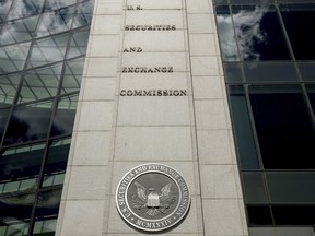 FILE - The U.S. Securities and Exchange Commission building in Washington is pictured on Aug. 5, 2017. The government on Wednesday, Dec. 14, 2022, charged eight men of earning more than $100 million in stock market profits by manipulating their novice-investor followers on social media. The Department of Justice and the Securities and Exchange Commission said that from early 2020 to around April of this year the men, who had combined following of over 1.5 million on Twitter, ran a "pump-and-dump" scheme.